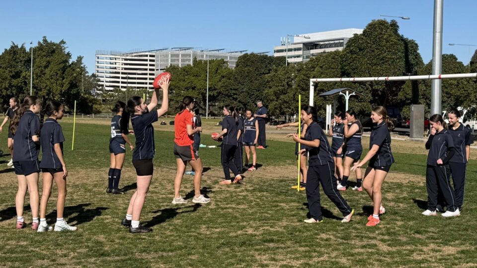 Our Junior AFL team participating in their skills session with The Sydney Swans last week