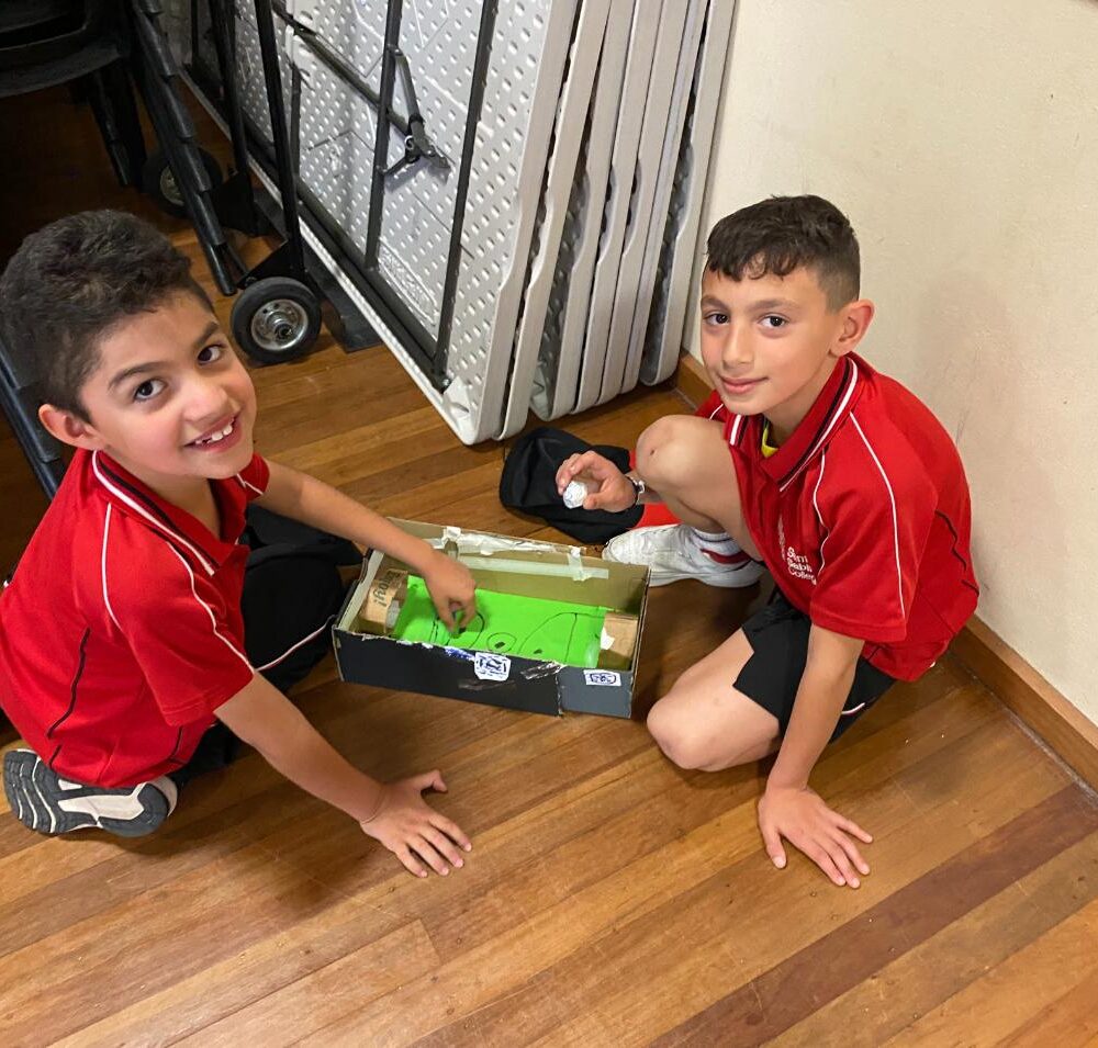 Charles and Sebastian enjoy fussball Year 2